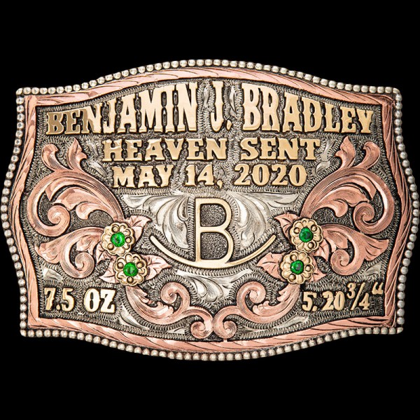 A custom buckle adorned with copper scrolls, jeweler's bronze letters and figure, four cubic zirconia stones, and bronze flowers. Personalize yours today!
